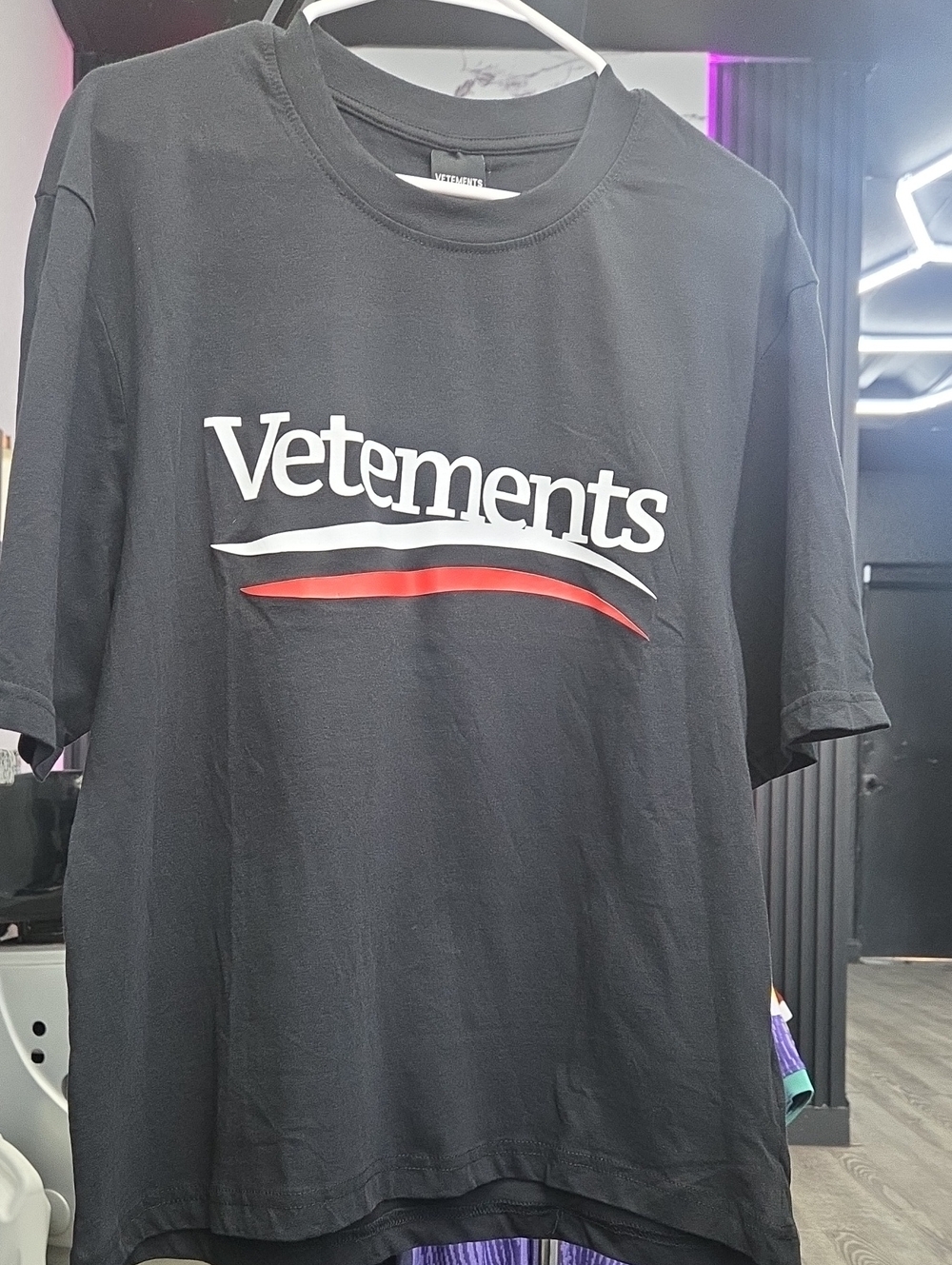 Vetements Black Tee with White Logo and Red Accent